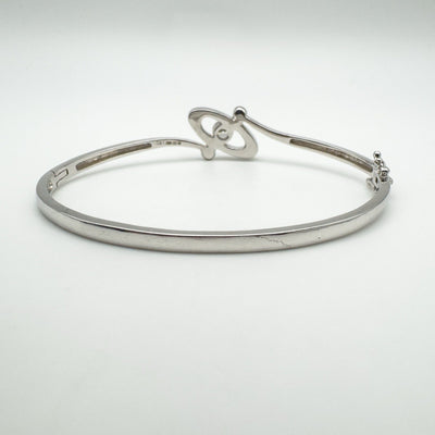 Rear profile of sterling silver bangle with round cut CZ