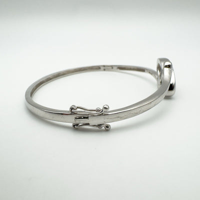 Side view showing safety catch on sterling silver CZ bangle