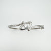 Top view of sterling silver bangle with central flush set CZ