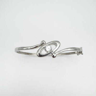 Top view of sterling silver bangle with central flush set CZ