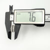 Caliper showing the width of silver earrings with black and white CZs