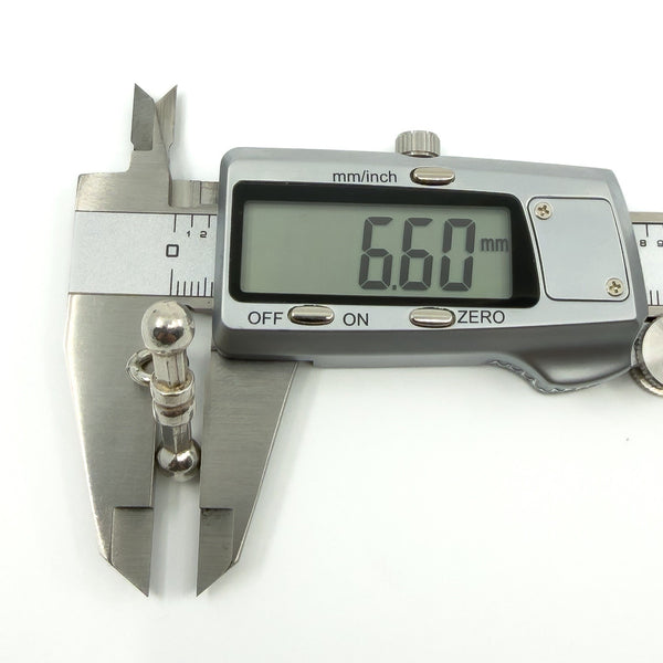 Digital caliper showing the T-bar pendant thickness at approximately 6.60mm.
