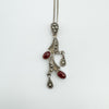 Front view of vintage carnelian and marcasite pendant on silver chain