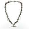 Sterling silver Albert chain coiled, showing both dog clips and the chunky fancy link design.