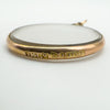 Close-up of 9ct gold hallmark for Chester 1906 stamped on locket frame