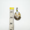 Sterling silver agate and peridot pendant shown beside ruler for scale