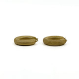 Side detail of chunky vintage 9ct gold mesh hoop earrings with textured finish