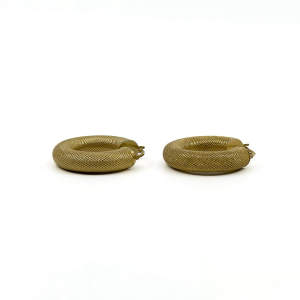 Side detail of chunky vintage 9ct gold mesh hoop earrings with textured finish