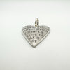 Angled front view of engraved solid silver love heart pendant
