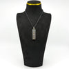Vintage sterling silver ingot pendant shown on a black display bust
