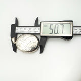 Digital calliper measuring large vintage sterling silver oval locket at 50.7mm length.