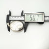 Digital calliper measuring large vintage sterling silver oval locket at 50.7mm length.