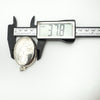 Digital calliper measuring width of vintage sterling silver oval locket at 37.8mm.