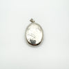 Front facing view of large engraved silver locket