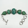 Chunky sterling silver bracelet with green turquoise stones and T-bar clasp