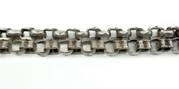Close-up of the sterling silver Albert chain links, showing the hammered-style texture and chunky build.