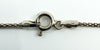 Close-up of the spring ring clasp and end fittings showing 925 stamp on the sterling silver chain.
