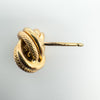 Close-up of hallmark on 9ct gold stud earring post showing London 2001 marks