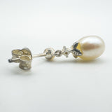 Close-up of 925 stamp and setting on pearl and CZ earring