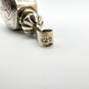 Close-up showing 925 silver stamp on bail of vintage perfume bottle pendant