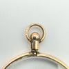 Detail of the screw-top bail stamped with registration number on antique gold locket