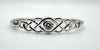 Detailed close-up of cubic zirconia set within sterling silver Celtic knot