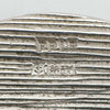 Macro image of hallmarks on silver cufflink marked PPLD, Anchor, Lion Passant, Y