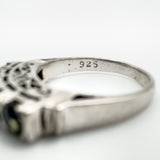 Inner band stamp reading 925 on sterling silver sapphire ring