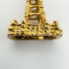 Macro shot of hallmarks on 9ct gold tower charm stamped 375 and leopard head