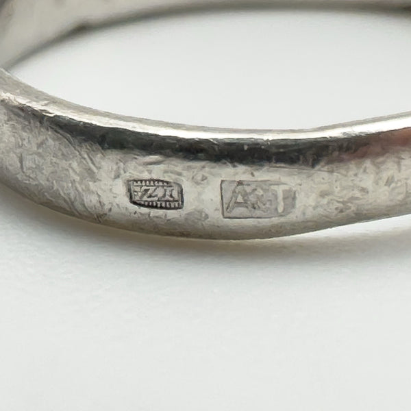 Detailed view of maker’s mark and sponsor’s stamp on vintage sterling silver ring