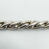 Detailed close-up showing the polished finish on the chunky silver rope links