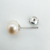 Close up of pearl stud and sterling silver 925 stamp on earring post