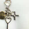 Close-up of sterling silver cross set with round cut diamond