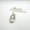 White Mother of Pearl pendant with geometric inlay on sterling silver chain