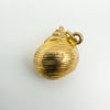 Close up of hallmark stamps on 9ct gold sea shell pendant