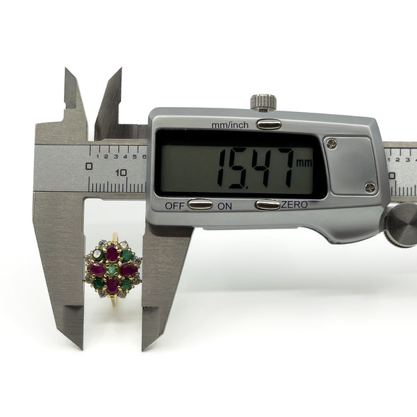 Caliper measurement of vintage 18ct gold ruby emerald and diamond cluster ring head at 15.47mm