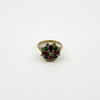 Vintage 18ct gold cocktail ring with ruby, emerald and diamond cluster viewed from the front