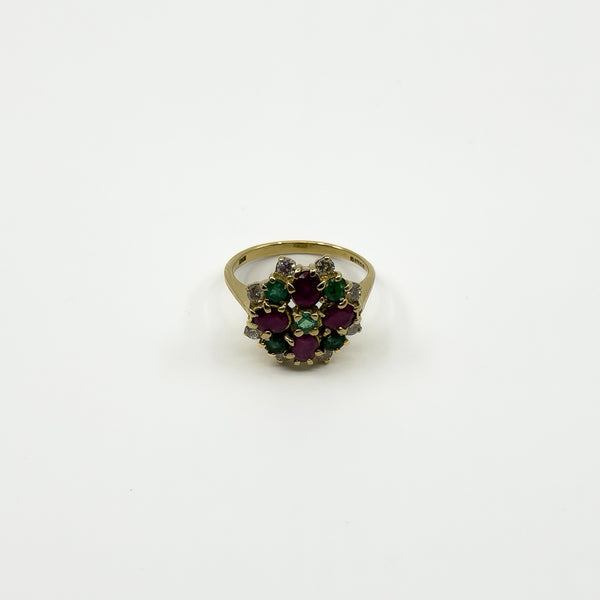 Vintage 18ct gold cocktail ring with ruby, emerald and diamond cluster viewed from the front