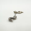 Focus on dragon tail sculpting in sterling silver jewellery design