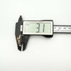 Side profile of antique glass locket showing slim 3.1mm depth on digital caliper
