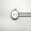 Measuring the depth of the vintage sterling silver locket at approximately 8.5mm