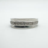 Front view of sterling silver diamond half hoop ring with flush claw setting