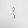 Flat lay image of silver diamond tooth pendant charm on white background