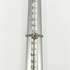 Antique platinum old-cut diamond solitaire ring shown on a ring size mandrel
