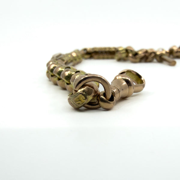 Antique 9ct rose gold Albert chain dog clip and fancy faceted links close up