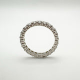 Edge-on view of platinum diamond band showing full eternity setting