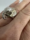 Chunky sterling silver elephant locket ring worn on hand, showing raised trunk and ear detail
