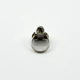 Back view of vintage sterling silver elephant locket ring showing the rounded band and head profile