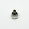 Back view of vintage sterling silver elephant locket ring showing the rounded band and head profile