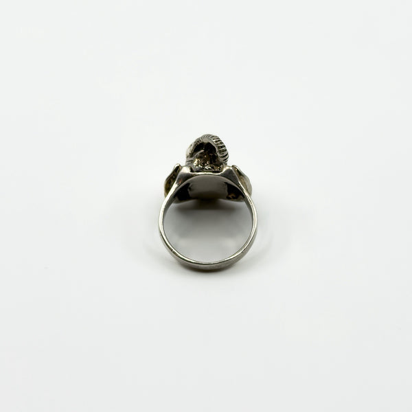 Back view of vintage sterling silver elephant locket ring showing the rounded band and head profile